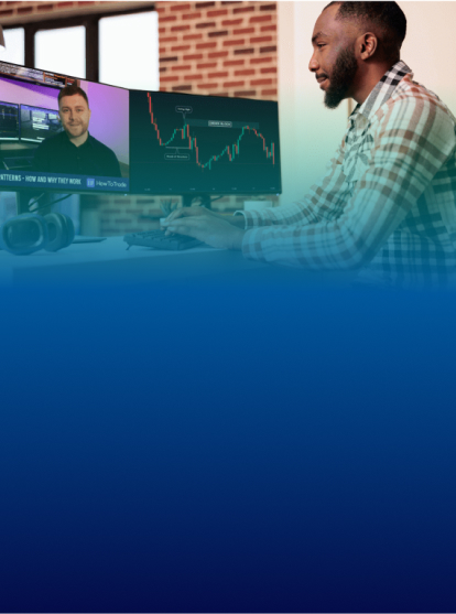 Happy trader at computer